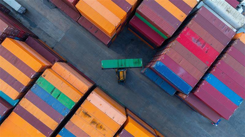 An aerial shot of a busy container port