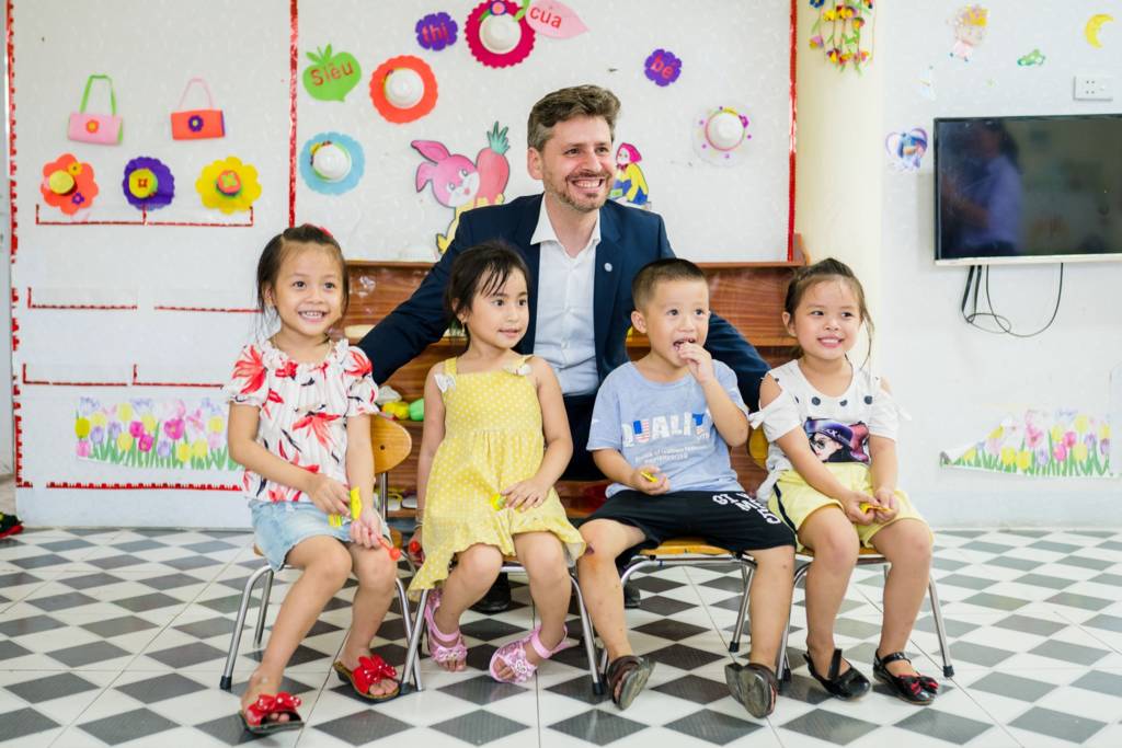 The OPEC Fund's Viet Nam Country Officer Dr Jaafar Al-Mahdi with some of the children that have benefited from the OPEC Fund co-financed Mai Phu Commune Kindergarten in Loc Ha District.