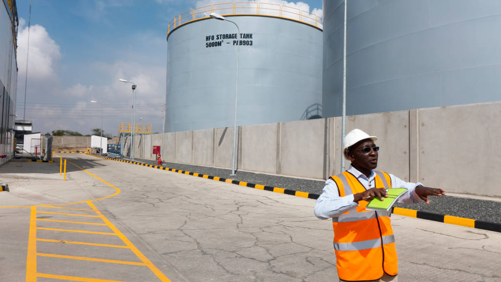 Benson Njiru, Chief Technical Officer at Gulf Power with the facility’s fuel tanks
