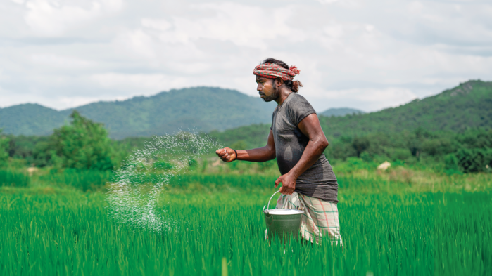 2026_OFQ3_man spreading fertilizer.png