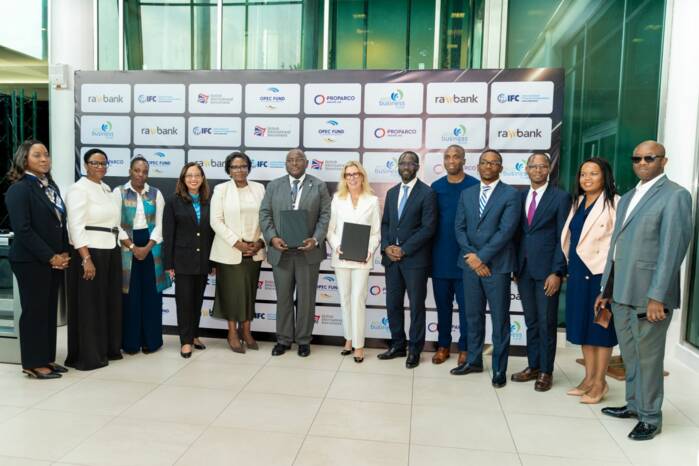 A group of people at the rawbank signing